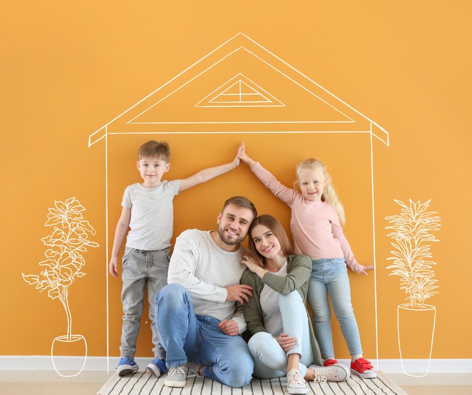 family picture with kids making a a house sign
